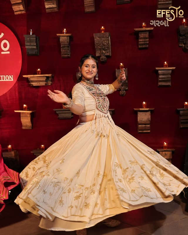 Garba dancer in cream traditional attire